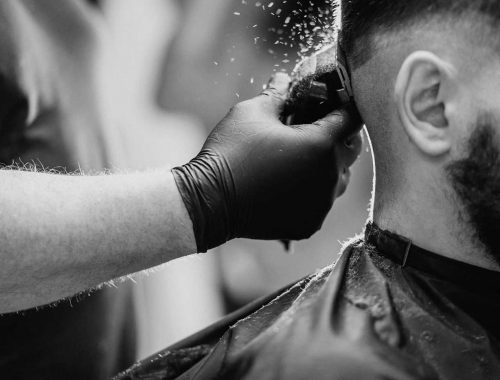 client-doing-hair-cut-at-barber-shop-salon
